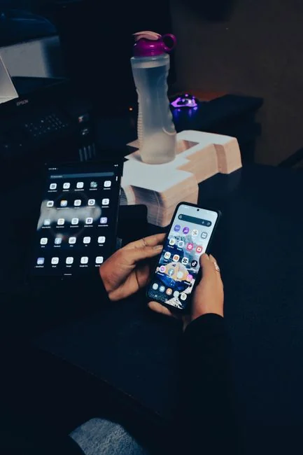 Woman marking her 30th birthday with a virtual celebration, cake, and lit candles.